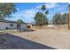 Large dirt backyard with a view of the home's exterior at 417 Freeman Ave, Las Vegas, NV 89106