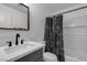 Bathroom featuring sleek vanity, modern fixtures, and tub-shower combo at 417 Freeman Ave, Las Vegas, NV 89106