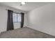 Bright bedroom with carpet, window, and curtains at 417 Freeman Ave, Las Vegas, NV 89106