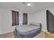 Bedroom featuring air mattress, window with curtains, and neutral carpet at 417 Freeman Ave, Las Vegas, NV 89106