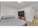 Bedroom with a bed, TV, and dresser in a clean, well-lit space at 417 Freeman Ave, Las Vegas, NV 89106