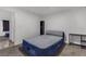 Bedroom featuring an air mattress set on a frame with black shelving and carpeting at 417 Freeman Ave, Las Vegas, NV 89106