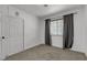 Bedroom featuring a window, carpet, and built-in closet at 417 Freeman Ave, Las Vegas, NV 89106