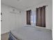 Bedroom featuring a large closet, window with dark curtains, and an air mattress at 417 Freeman Ave, Las Vegas, NV 89106