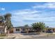 Inviting single-story home featuring a manicured lawn and a cozy entrance under a bright sky at 417 Freeman Ave, Las Vegas, NV 89106