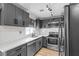 Updated kitchen featuring grey cabinets, stainless steel appliances, and an undermount sink at 417 Freeman Ave, Las Vegas, NV 89106