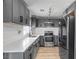 Well-equipped kitchen with stainless steel appliances, sleek gray cabinetry, and ample counter space at 417 Freeman Ave, Las Vegas, NV 89106