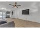 Modern living area featuring sleek hardwood floors, a mounted TV, and contemporary decor at 417 Freeman Ave, Las Vegas, NV 89106