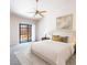 Comfortable bedroom with soft carpet, a ceiling fan, and access to the backyard through sliding glass doors at 4378 Cherrystone Ct, Las Vegas, NV 89121