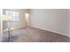 Carpeted bedroom with a window and access to hallway at 4378 Cherrystone Ct, Las Vegas, NV 89121
