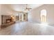 Cozy living room with tile flooring, a fireplace, and a ceiling fan at 4378 Cherrystone Ct, Las Vegas, NV 89121