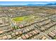 An aerial view showcases the expansive community, highlighting the homes, streets, and nearby parks at 4511 Stardusk Falls Ave, North Las Vegas, NV 89084