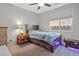 Cozy bedroom with a comfortable bed, neutral tones, and ceiling fan at 4511 Stardusk Falls Ave, North Las Vegas, NV 89084