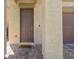 Inviting front entryway featuring a covered porch, brick pavers, and a solid front door at 4511 Stardusk Falls Ave, North Las Vegas, NV 89084