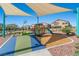 A modern playground features colorful play structures and shaded areas for community enjoyment at 4511 Stardusk Falls Ave, North Las Vegas, NV 89084