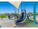 Community playground featuring slides, climbing structures, and a colorful, playful environment at 4511 Stardusk Falls Ave, North Las Vegas, NV 89084