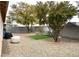 Wide backyard featuring rock landscaping and mature trees at 4618 Zia Ridge St, North Las Vegas, NV 89031