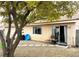 Lush backyard featuring a small patio, mature tree, and stone pathway at 4618 Zia Ridge St, North Las Vegas, NV 89031