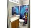Bathroom with a shower and stylish shower curtain next to the toilet and vanity at 4618 Zia Ridge St, North Las Vegas, NV 89031
