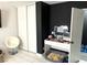 Cozy bedroom featuring a white vanity, white chair, and black accent wall at 4618 Zia Ridge St, North Las Vegas, NV 89031