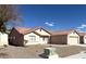 Exterior angle shot of single-story home with terracotta roof, desert landscaping, and neutral color palette at 4618 Zia Ridge St, North Las Vegas, NV 89031