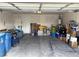 Spacious garage with clutter, cement floor, and a back door for easy access at 4618 Zia Ridge St, North Las Vegas, NV 89031