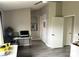 Office featuring gray wood floors, neutral walls, a ceiling fan and natural light at 4618 Zia Ridge St, North Las Vegas, NV 89031