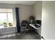 Office featuring gray wood floors, multiple desks, neutral walls and natural light at 4618 Zia Ridge St, North Las Vegas, NV 89031