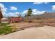 Spacious backyard featuring a shed, block wall, and ample space for outdoor activities at 5109 Gains Mill St, Las Vegas, NV 89122