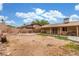 Expansive backyard featuring a covered patio and plenty of space for outdoor entertainment at 5109 Gains Mill St, Las Vegas, NV 89122