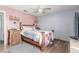 Comfortable bedroom features wood-look floors and a rustic wood-frame bed, and stylish accents at 5109 Gains Mill St, Las Vegas, NV 89122