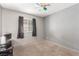 Bedroom with neutral walls, a small window with black curtains, and a ceiling fan at 5109 Gains Mill St, Las Vegas, NV 89122
