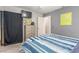 Bedroom featuring a dresser, mounted TV, and neutral-toned walls at 5109 Gains Mill St, Las Vegas, NV 89122