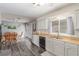 Combined kitchen and dining area with stainless steel appliances and wood countertops at 5109 Gains Mill St, Las Vegas, NV 89122