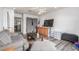 Cozy living room with dark floors, a gray couch, and a ceiling fan at 5109 Gains Mill St, Las Vegas, NV 89122