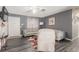 Cozy living room featuring neutral walls, wood-look floors, comfortable seating, and a ceiling fan at 5109 Gains Mill St, Las Vegas, NV 89122