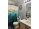Neat bathroom with a shower curtain and vanity, complemented by a well-lit mirror at 5165 Briar Meadow Way, Las Vegas, NV 89118