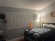 Cozy bedroom with a bright window and an eye-catching decorative blanket at 5165 Briar Meadow Way, Las Vegas, NV 89118