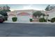 Charming home featuring a two-car garage, desert landscaping, and inviting curb appeal at 5165 Briar Meadow Way, Las Vegas, NV 89118