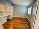 Office with built-in bookshelves, cabinets, and a bright window at 5165 Briar Meadow Way, Las Vegas, NV 89118