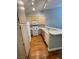 Bright kitchen featuring white appliances and hardwood floors at 5165 Briar Meadow Way, Las Vegas, NV 89118