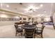 Large basement with a billiards table, game table, and multiple seating areas at 52 Innisbrook Ave, Las Vegas, NV 89113