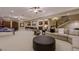 Expansive basement area featuring a billiards table, home theater, and comfortable seating at 52 Innisbrook Ave, Las Vegas, NV 89113
