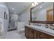 Bright bathroom with a spacious vanity, toilet, and a glass-enclosed shower at 52 Innisbrook Ave, Las Vegas, NV 89113
