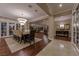 Elegant dining area with chandelier, hardwood floors, dining table and access to other living spaces at 52 Innisbrook Ave, Las Vegas, NV 89113