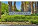 Innisbrook community entrance sign surrounded by lush greenery and colorful flowers at 52 Innisbrook Ave, Las Vegas, NV 89113