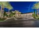 Stunning two-story home with lush landscaping and a spacious driveway with a three car garage at night at 52 Innisbrook Ave, Las Vegas, NV 89113