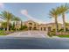 Beautiful two-story home with lush landscaping, a spacious driveway, and a convenient three-car garage at 52 Innisbrook Ave, Las Vegas, NV 89113