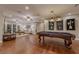 Spacious game room with billiards table, hardwood floors and ample entertaining space at 52 Innisbrook Ave, Las Vegas, NV 89113