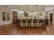 Spacious gourmet kitchen with large island, counter seating, and hardwood floors at 52 Innisbrook Ave, Las Vegas, NV 89113